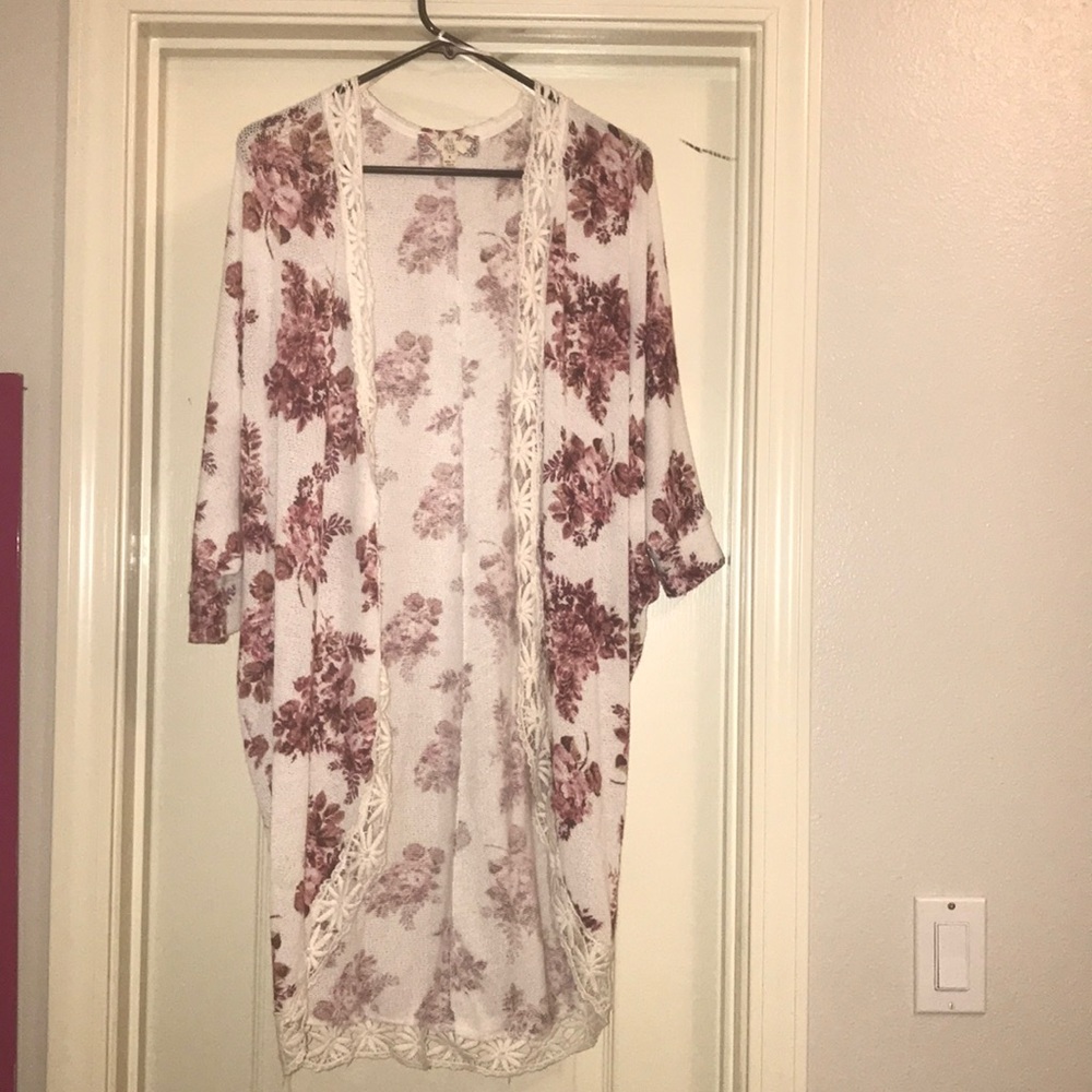 white knit cardigan with pink floral pattern